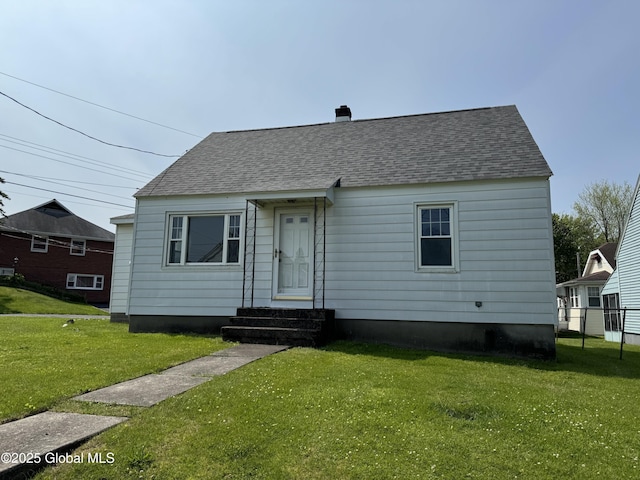 46 Elmhurst Ave, Albany, NY 12203 - view of front of house featuring a shingled roof and a chimney