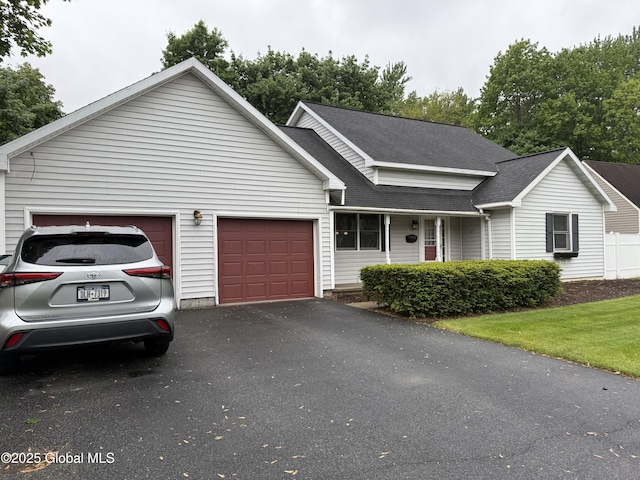 12 Graves St, Glens Falls, NY 12801 - view of front of property featuring an attached garage, driveway, and a shingled roof