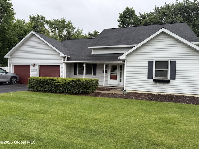 12 Graves St, Glens Falls, NY 12801 - view of front facade featuring an attached garage, a front yard, a shingled roof, and asphalt driveway