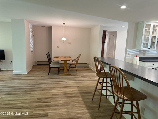 12 Graves St, Glens Falls, NY 12801 - dining space featuring light wood-type flooring, baseboards, and recessed lighting