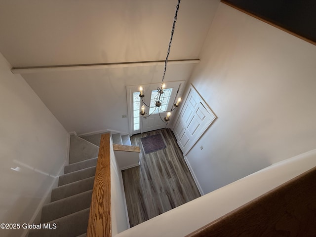 12 Graves St, Glens Falls, NY 12801 - stairway featuring wood finished floors, a chandelier, and a high ceiling