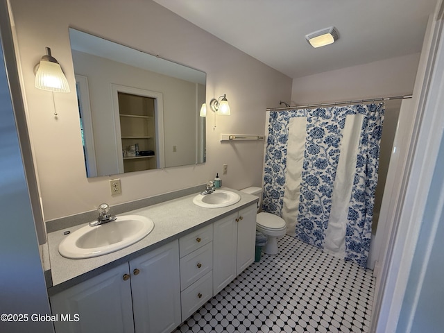 12 Graves St, Glens Falls, NY 12801 - full bath featuring double vanity, toilet, and curtained shower