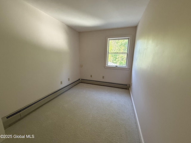 12 Graves St, Glens Falls, NY 12801 - unfurnished room featuring baseboards, light colored carpet, and a baseboard radiator