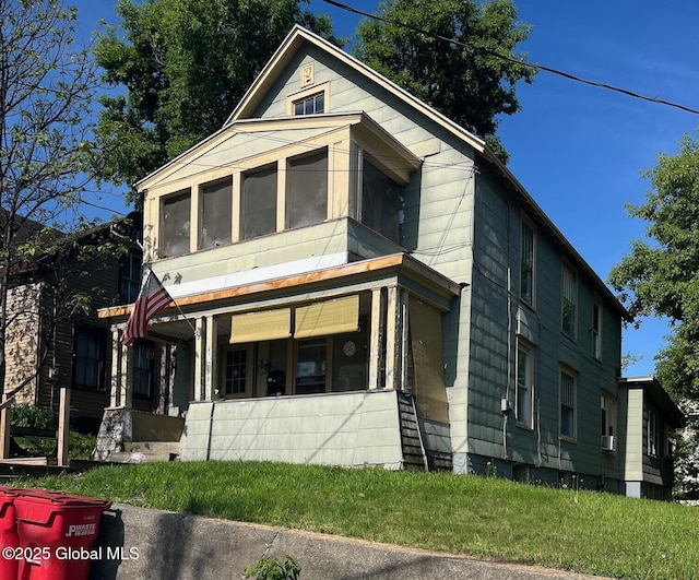 159 Champlain Ave, Ticonderoga, NY 12883 - view of front of property featuring a sunroom
