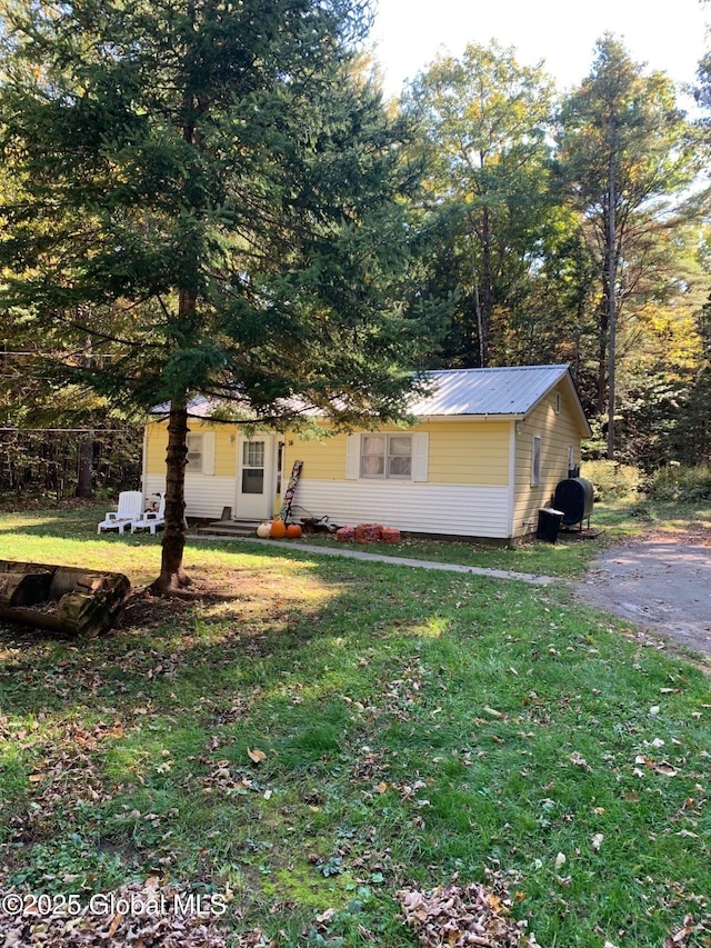 326 Middle Rd, Crown Point, NY 12928 - view of front of property featuring a front lawn and metal roof