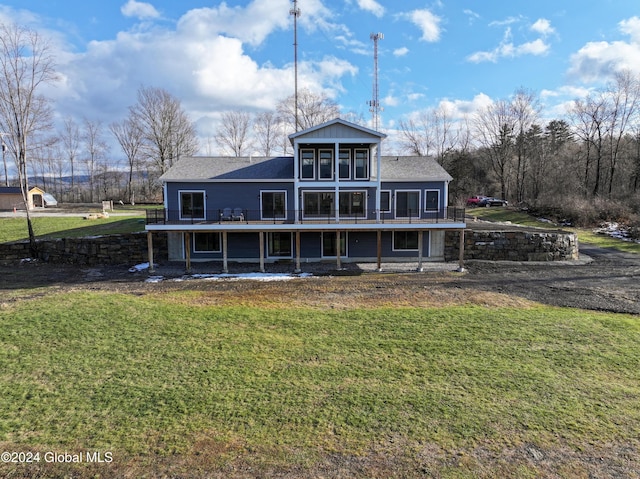 74 Dick Hyatt Ln, Whitehall, NY 12887 - back of house featuring a lawn, a shingled roof, and a wooden deck