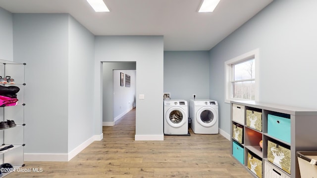 74 Dick Hyatt Ln, Whitehall, NY 12887 - laundry room with washer and dryer, light wood-style flooring, and baseboards