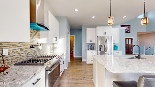 74 Dick Hyatt Ln, Whitehall, NY 12887 - kitchen featuring stainless steel appliances, wall chimney range hood, a sink, light wood-style flooring, and light stone countertops
