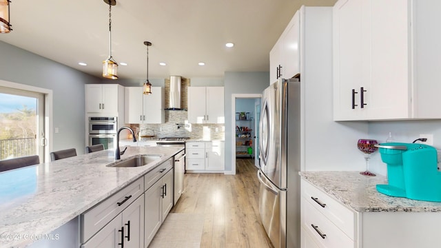 74 Dick Hyatt Ln, Whitehall, NY 12887 - kitchen with a sink, appliances with stainless steel finishes, wall chimney exhaust hood, light wood finished floors, and white cabinetry