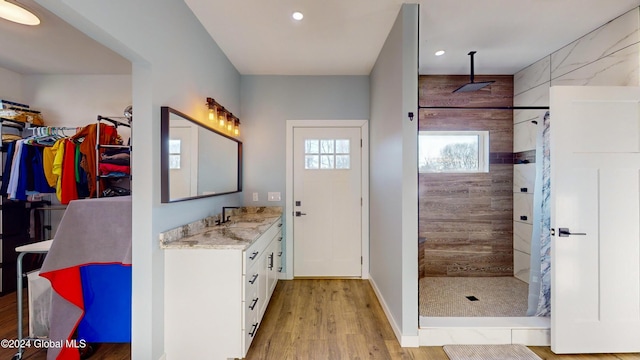 74 Dick Hyatt Ln, Whitehall, NY 12887 - full bathroom featuring vanity, wood finished floors, walk in shower, recessed lighting, and a spacious closet
