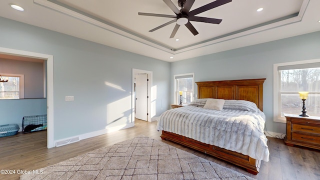 74 Dick Hyatt Ln, Whitehall, NY 12887 - bedroom with a raised ceiling, wood finished floors, recessed lighting, baseboards, and a ceiling fan