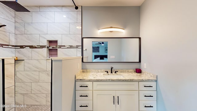 74 Dick Hyatt Ln, Whitehall, NY 12887 - bathroom with tiled shower, vanity, and a ceiling fan