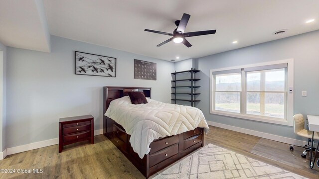74 Dick Hyatt Ln, Whitehall, NY 12887 - bedroom featuring baseboards, wood finished floors, recessed lighting, and a ceiling fan