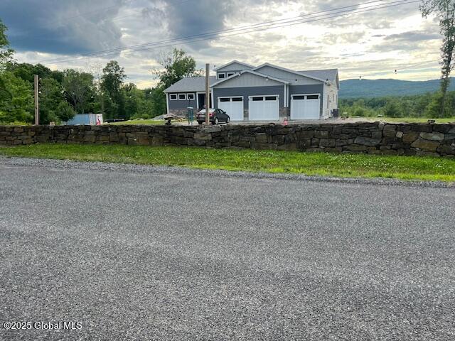 74 Dick Hyatt Ln, Whitehall, NY 12887 - view of front of home with a garage