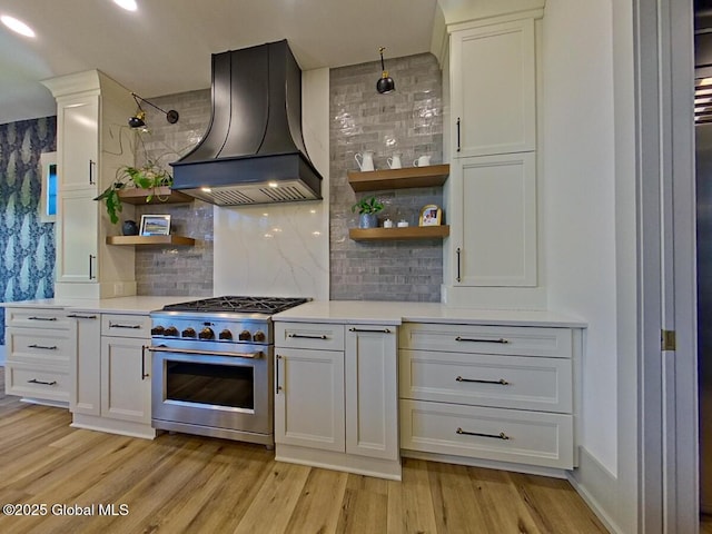 22 Burnham Rd, Wilton, NY 12831 - kitchen featuring custom range hood, high end stainless steel range oven, open shelves, light countertops, and light wood-style floors
