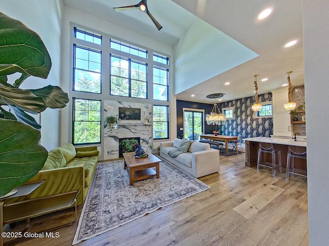 22 Burnham Rd, Wilton, NY 12831 - living area featuring healthy amount of natural light, a ceiling fan, light wood-style flooring, recessed lighting, and a fireplace