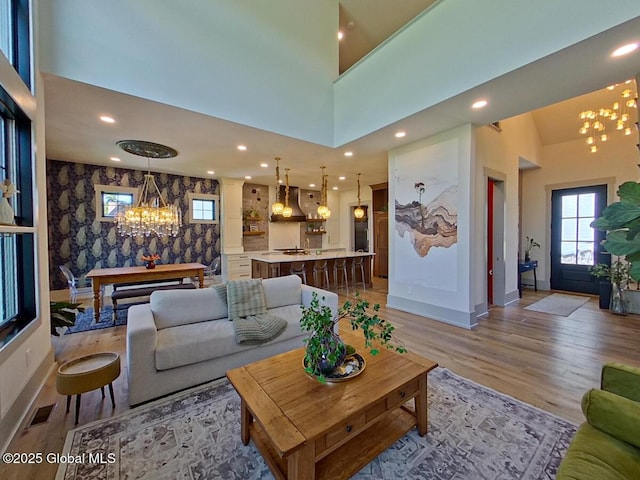 22 Burnham Rd, Wilton, NY 12831 - living room featuring a chandelier, light wood finished floors, decorative columns, recessed lighting, and baseboards
