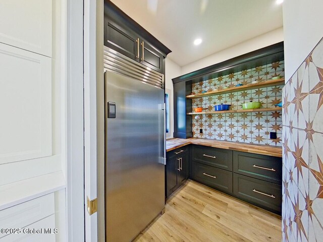 22 Burnham Rd, Wilton, NY 12831 - bar area with stainless steel built in refrigerator, light wood-type flooring, and backsplash