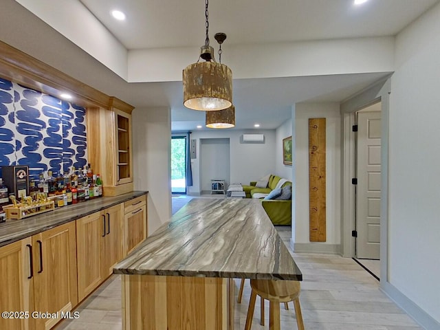 22 Burnham Rd, Wilton, NY 12831 - bar area with a wall mounted air conditioner, hanging light fixtures, recessed lighting, baseboards, and light wood-style floors