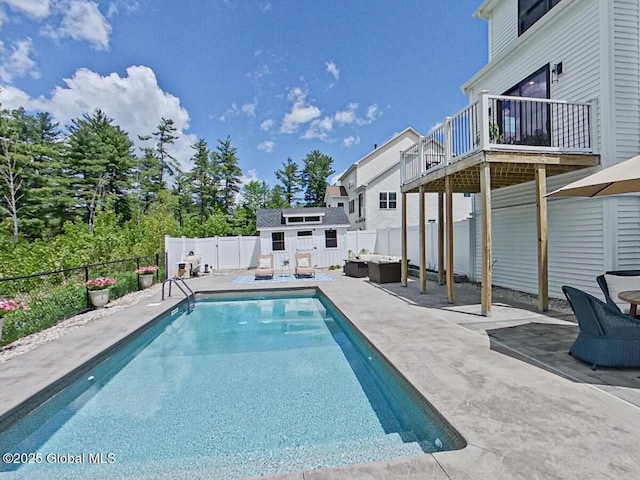22 Burnham Rd, Wilton, NY 12831 - view of pool with an outdoor structure, a fenced backyard, a patio area, and outdoor lounge area