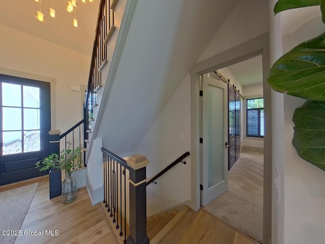 22 Burnham Rd, Wilton, NY 12831 - stairway featuring a barn door and wood finished floors