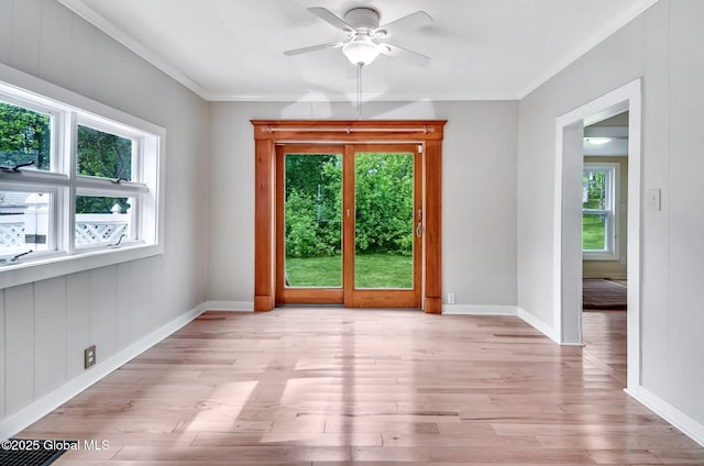44 Hudson Ave, Bethlehem, NY 12054 - empty room with healthy amount of natural light, ceiling fan, light wood finished floors, baseboards, and ornamental molding