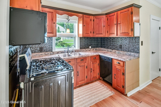 44 Hudson Ave, Bethlehem, NY 12054 - kitchen featuring dishwasher, stainless steel range with gas cooktop, a sink, light wood finished floors, and ornamental molding