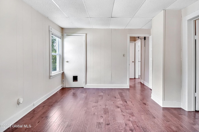 44 Hudson Ave, Bethlehem, NY 12054 - empty room featuring wood finished floors, baseboards, and a drop ceiling