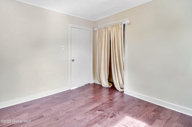 44 Hudson Ave, Bethlehem, NY 12054 - spare room with ornamental molding, wood finished floors, and baseboards