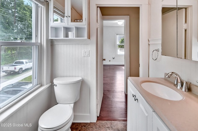 44 Hudson Ave, Bethlehem, NY 12054 - bathroom with toilet, vanity, healthy amount of natural light, and baseboards