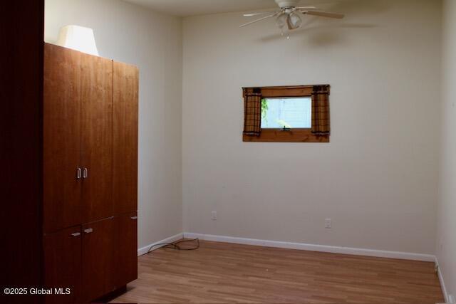 7 Garden Aly, Albany, NY 12210 - empty room featuring a ceiling fan, light wood finished floors, and baseboards