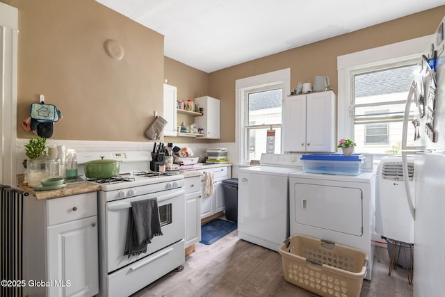 1165 Glenwood Blvd, Schenectady, NY 12308 - laundry area with washing machine and dryer and light wood-type flooring