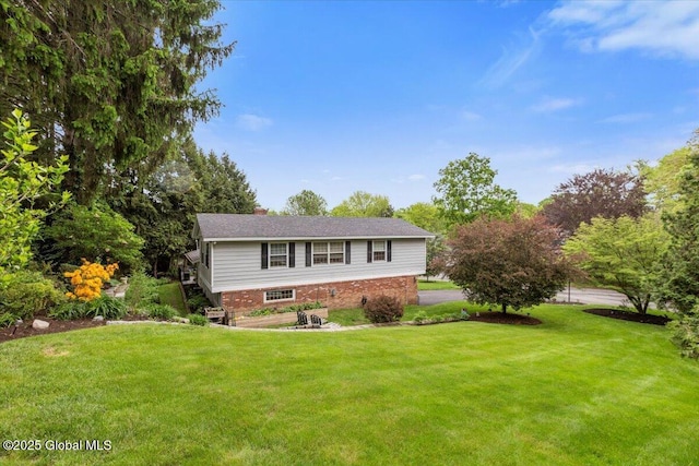 1335 Stanley Ln, Niskayuna, NY 12309 - view of front facade with a front yard and brick siding