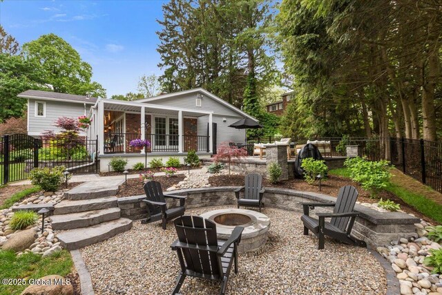 1335 Stanley Ln, Niskayuna, NY 12309 - back of house with a fire pit and a patio