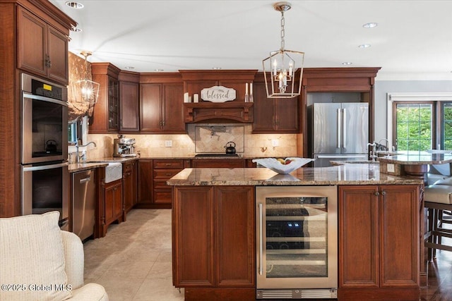 1335 Stanley Ln, Niskayuna, NY 12309 - kitchen featuring beverage cooler, stainless steel appliances, a chandelier, a sink, and backsplash