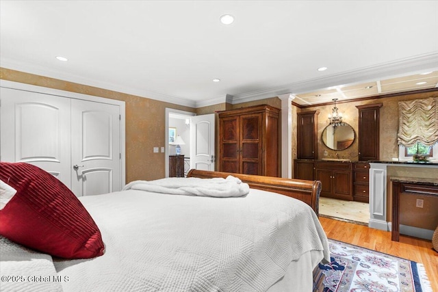 1335 Stanley Ln, Niskayuna, NY 12309 - bedroom featuring light wood-style floors, recessed lighting, a closet, ensuite bath, and crown molding