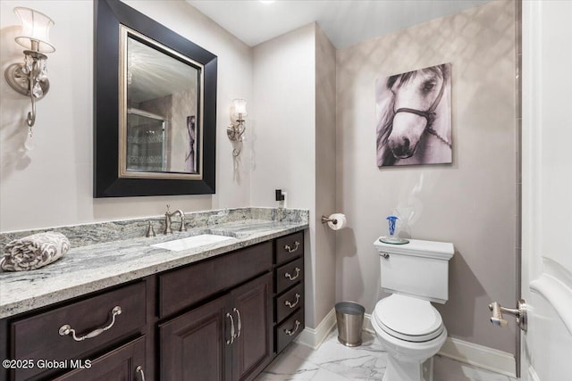 1335 Stanley Ln, Niskayuna, NY 12309 - bathroom featuring baseboards, marble look tile flooring, vanity, and toilet