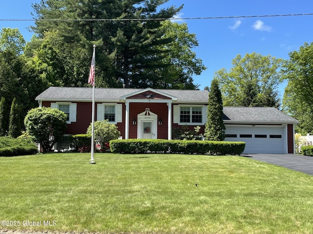 17 Sylvan Ln, Clifton Park, NY 12065 - split foyer home with a front yard, an attached garage, driveway, and roof with shingles