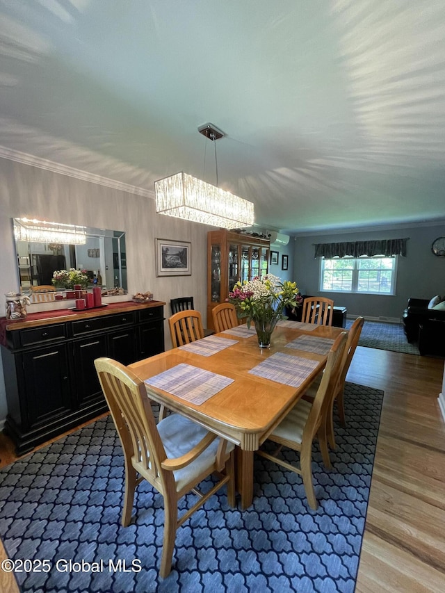 17 Sylvan Ln, Clifton Park, NY 12065 - dining area featuring light wood-style floors, a chandelier, and crown molding