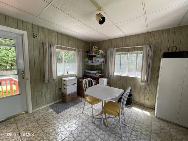 17 Sylvan Ln, Clifton Park, NY 12065 - dining area featuring wooden walls, healthy amount of natural light, light flooring, and baseboards