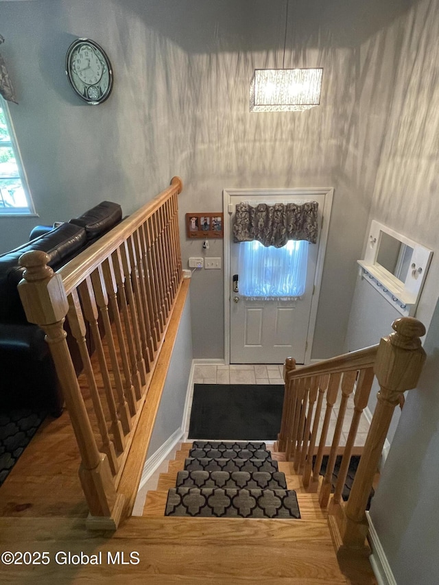 17 Sylvan Ln, Clifton Park, NY 12065 - foyer featuring baseboards, wood finished floors, and stairway