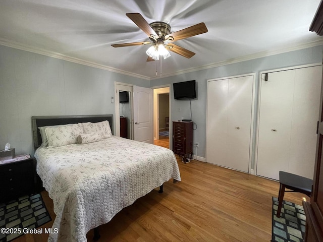 17 Sylvan Ln, Clifton Park, NY 12065 - bedroom featuring two closets, light wood finished floors, crown molding, and ceiling fan