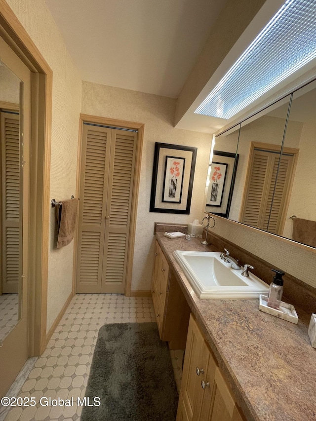 17 Sylvan Ln, Clifton Park, NY 12065 - full bath with a closet, vanity, tile patterned floors, and baseboards