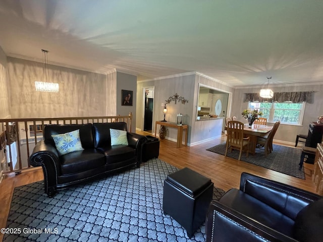 17 Sylvan Ln, Clifton Park, NY 12065 - living room with a chandelier, wood finished floors, baseboards, and crown molding