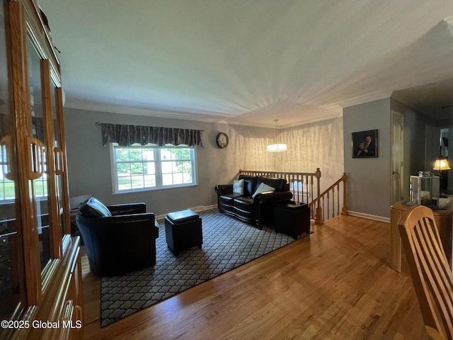 17 Sylvan Ln, Clifton Park, NY 12065 - living room with wood finished floors, crown molding, baseboards, and a chandelier