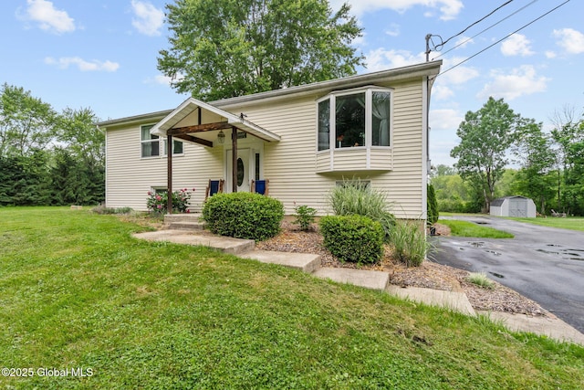 13 Willow Ln, Halfmoon, NY 12118 - split foyer home with a storage shed, a front lawn, and driveway