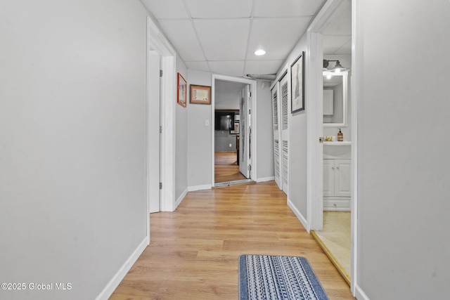 13 Willow Ln, Halfmoon, NY 12118 - corridor featuring a paneled ceiling, light wood-style floors, and recessed lighting