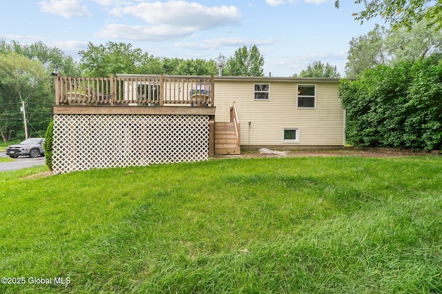 13 Willow Ln, Halfmoon, NY 12118 - back of house featuring stairway, a lawn, and a wooden deck