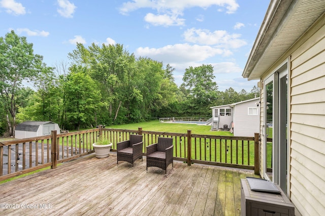 13 Willow Ln, Halfmoon, NY 12118 - wooden deck featuring a storage unit, a yard, and view of scattered trees