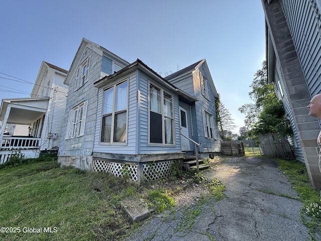 207 Fon Clair St, Johnstown, NY 12095 - view of side of property with asphalt driveway